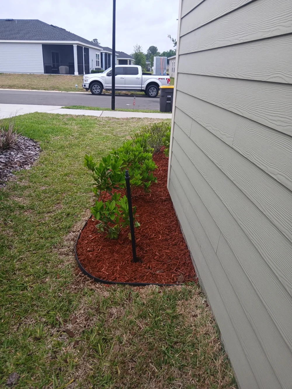 After lawn and landscape bed care: a clean finish along the side yard