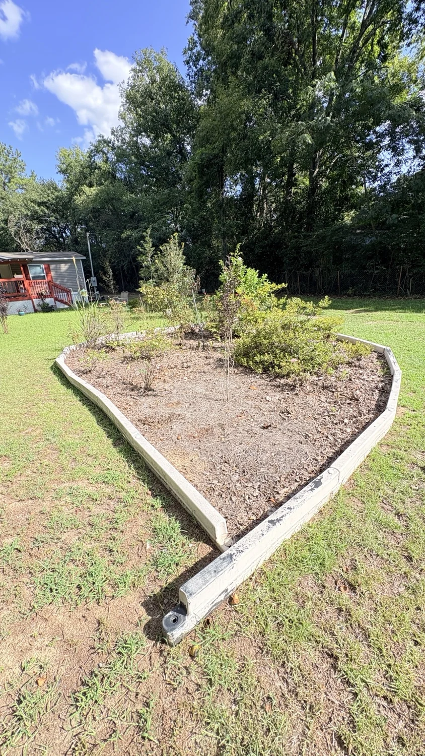 Before landscape bed · another view: customer property before Fixed by Hicks lawn care