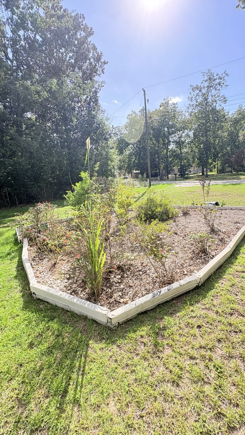 Before landscape bed · opposite view: customer property before Fixed by Hicks lawn care