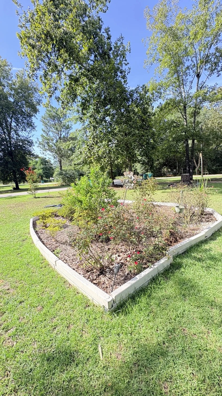 Before landscape bed · garden view: customer property before Fixed by Hicks lawn care